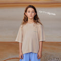 Sustainable cream kids' T-shirt by Earthlings United, made from soft organic cotton for long-lasting wear.